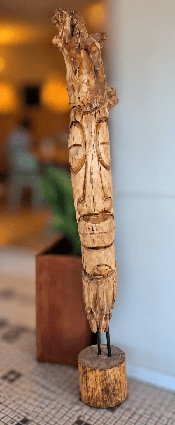 Wooden carving of a face